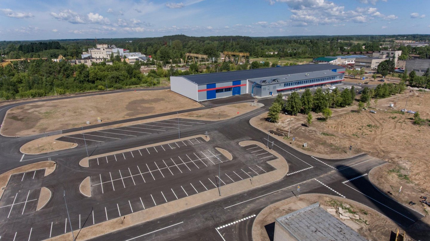 Ražošanas ēkas jaunbūve. “Rūpniecības kompleksa ar ražošanas korpusu, administratīvo – sadzīves ēku palīgtelpām, tehniskajām telpām. Adrese: Viļakas ielā 1, Rēzekne